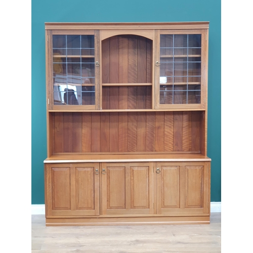 8 - A modern teak Wall Unit with pair of lead glazed doors to upper section above base fitted three cupb... 