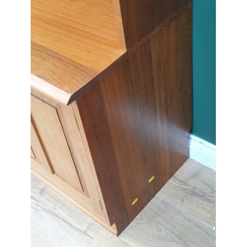 8 - A modern teak Wall Unit with pair of lead glazed doors to upper section above base fitted three cupb... 