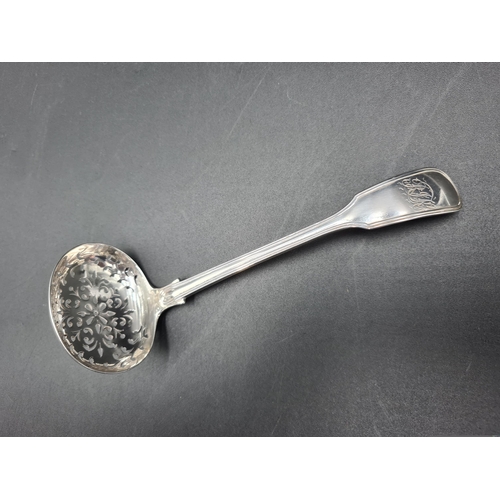 92 - A Victorian silver Sifting Ladle fiddle and thread pattern engraved initials, London 1851