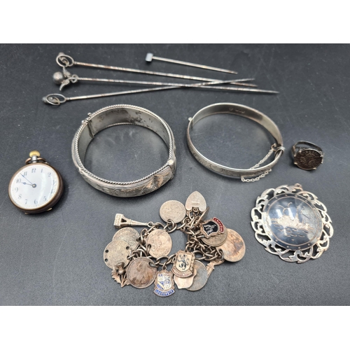 96 - A George V silver Hatpin, Birmingham 1910, three others, two silver Bangles, silver coin and charm B... 