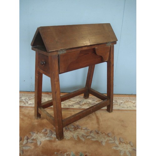 49 - A 19th Century stained pine Saddle Horse with fall flaps converting to a table, fitted drawer to eac... 