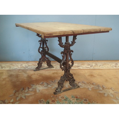14 - A pine topped Pub Table on cast iron base 4ft 1in L x 2ft 6in H x 2ft 4in W