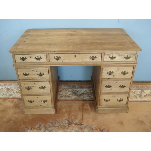 10 - A 19th Century pine Pedestal Writing Desk fitted nine drawers 4ft W x 2ft 6in H x 2ft 3in D