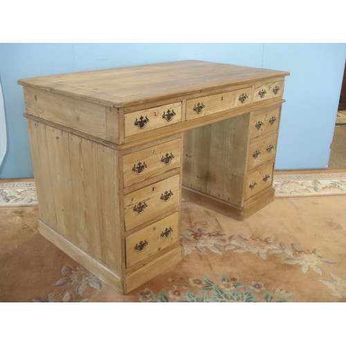 10 - A 19th Century pine Pedestal Writing Desk fitted nine drawers 4ft W x 2ft 6in H x 2ft 3in D