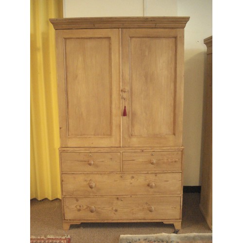 91 - A Victorian country pine Linen Press/Wardrobe fitted pair of cupboard doors above base of two short ... 