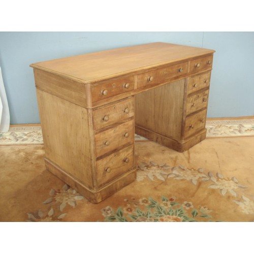 129 - A Victorian stripped mahogany Pedestal Desk fitted nine drawers 4ft W x 2ft 5in H x 1ft 10in D