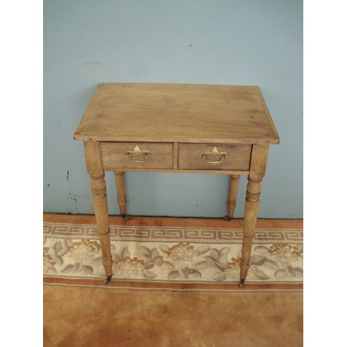 33 - A Victorian mahogany Side Table fitted two frieze drawers raised on tuned supports and casters 2ft 4... 