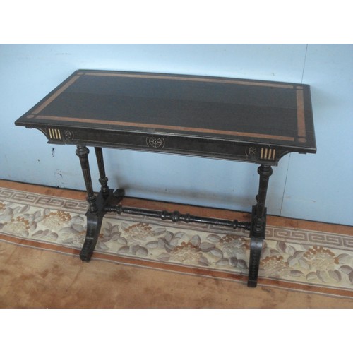 18 - A Victorian ebonised Side Table with walnut inlay, raised on turned supports united by H-stretcher a... 