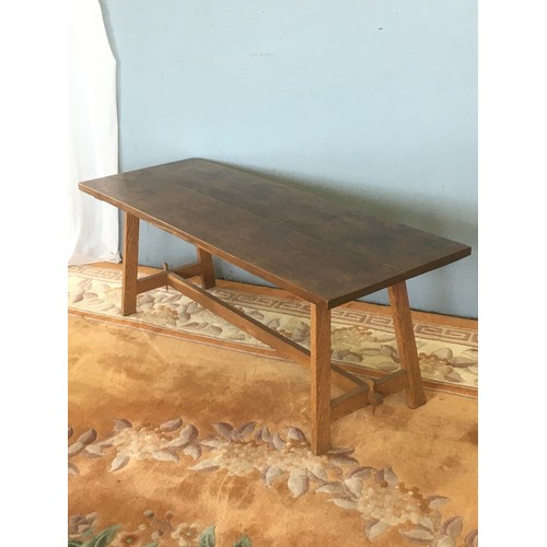 9 - An oak Coffee Table on H-stretcher supports 4ft W x 1ft 5in H