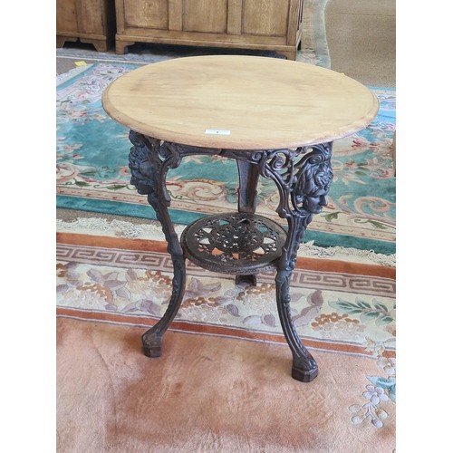 3 - A Victorian circular Pub Table with scrub top on cast iron base 2ft 4in H x 2ft D