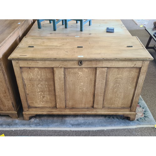 15 - A Georgian oak Coffer with fielded three panel front raised on bracket feet 4ft 1in W x 2ft 7in H x ... 