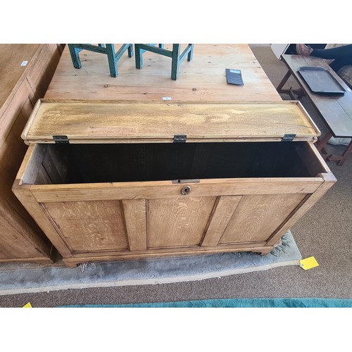 15 - A Georgian oak Coffer with fielded three panel front raised on bracket feet 4ft 1in W x 2ft 7in H x ... 