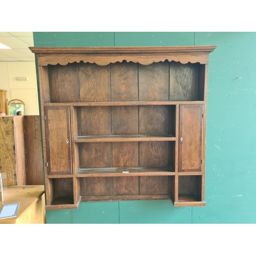 17 - An antique oak and mahogany crossbanded Plate Rack fitted pair of cupboard doors 4ft 2in W x 3ft 10i... 