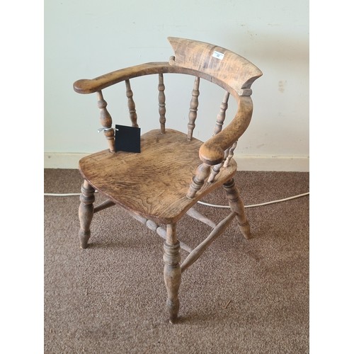 22 - A Victorian ash and elm Smoker's Bow Armchair with turned spindle back 2ft 7in H x 1ft 3in W