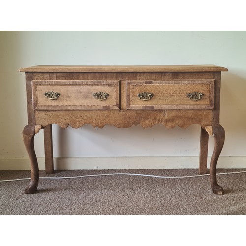85 - A 19th Century oak and mahogany crossbanded Dresser Base fitted two frieze drawers above shaped frie... 