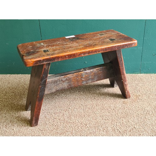 140 - A Victorian stained pine Milking Stool on splayed supports 1ft 8in W x 1ft 1in H