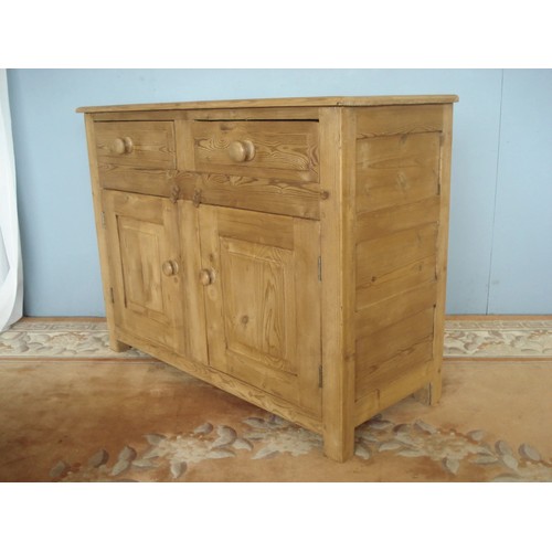 50 - An antique pine small Dresser Base fitted two frieze drawers above pair of panelled cupboard doors 3... 
