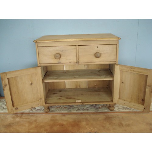 4 - A Victorian pine small Dresser Base fitted pair of drawers above pair of Cupid's Bow panelled doors ... 