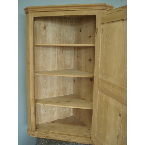 47 - An antique pine hanging Corner Cupboard fitted single panelled door 4ft H x 2ft 8in W x 1ft 7in D