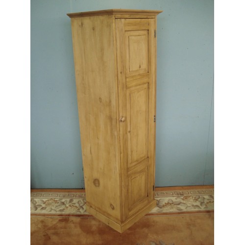 65 - An antique pine 'Sentry Box' narrow Cupboard fitted single panelled door enclosing shelves on plinth... 