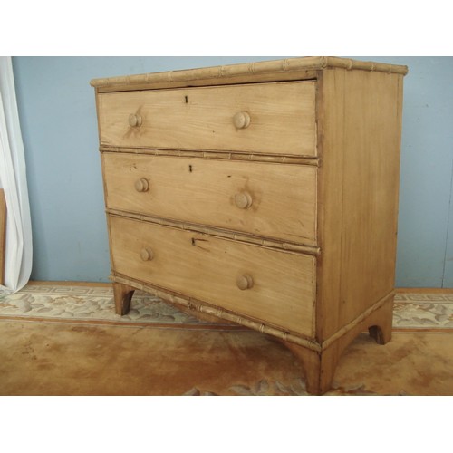 81 - A 19th Century pine Chest of three long drawers with simulated bamboo moulding raised on bracket fee... 