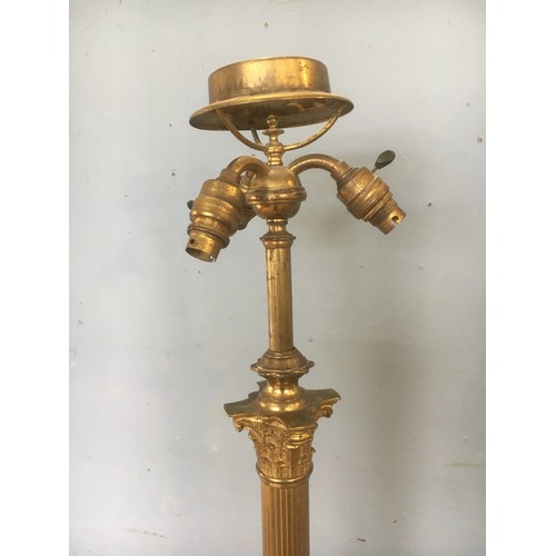 88 - A brass Standard Lamp with Corinthian Column, three bulb sockets and raised on square base with paw ... 