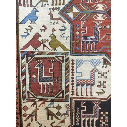 101 - A hand woven Azari Soumak Rug with stylised bird and animal design 7ft L x 4ft 7in W