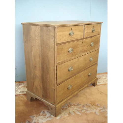 127 - A 19th Century oak and mahogany crossbanded Chest of two short and three long drawers raised on ogee... 