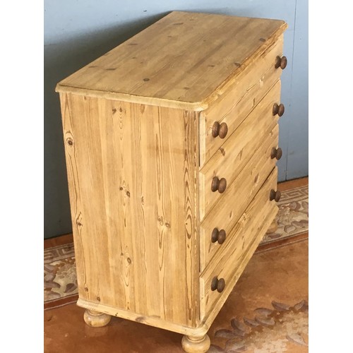 136 - A pine Chest of four long drawers raised on turned feet 2ft 10in W x 2ft 9in H x 1ft 6in D