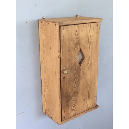 143 - An antique pine single door Wall Cupboard with diamond carved gauze filled hole in door 2ft 4in H x ... 