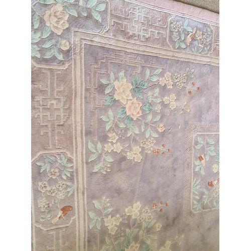 147 - A Chinese style Carpet with central floral infilled square on pink ground 10ft 10inL x 8ft 4in W