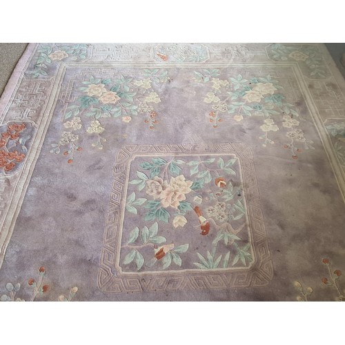 147 - A Chinese style Carpet with central floral infilled square on pink ground 10ft 10inL x 8ft 4in W