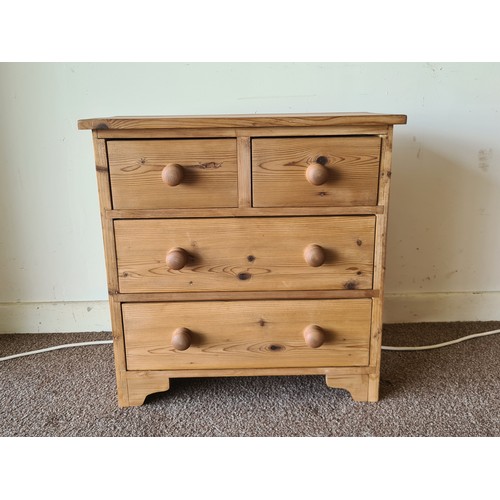 23 - A modern pine small Chest of two short over two long drawers on bracket feet 2ft W x 2ft H