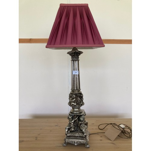 77 - A decorative Rococo style metal Table Lamp and shade with cherubs to base 2ft 7in H