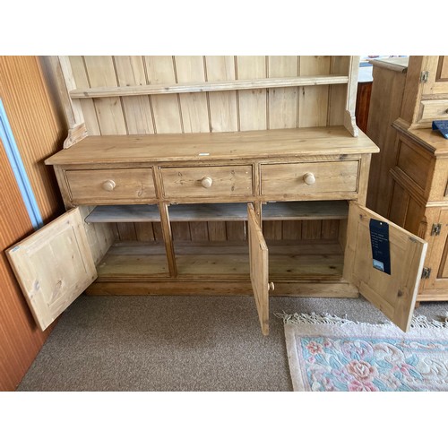 87 - An antique pine Dresser and Rack, the base fitted three drawers above three cupboard doors on plinth... 