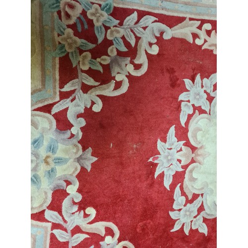 180 - A red ground Chinese style Rug 7ft 8in L x 5ft 10in W and a cream ground Rug 6ft 4in L x 3ft 1in W