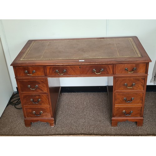 187 - A reproduction mahogany veneered Pedestal Desk with tooled leather top fitted nine drawers 4ft 2in W... 