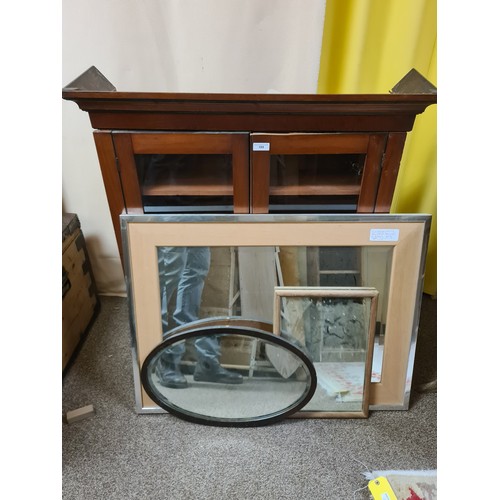 189 - A modern Wall Mirror, two other Wall Mirrors and a mahogany and glazed Bookcase