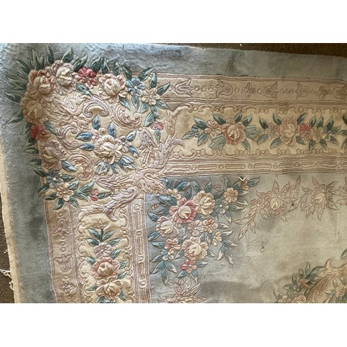 150 - A large Chinese style turquoise Carpet with floral border 12ft 4in L x 9ft W