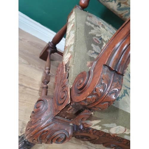 533 - A carved walnut Carolean style Throne Elbow Chair with floral upholstered back and seats, acanthus c... 