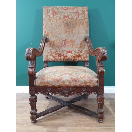 535 - A carved walnut Carolean style Throne Elbow Chair with floral upholstered back and seat, acanthus ca... 