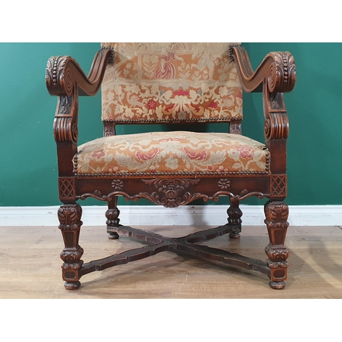 535 - A carved walnut Carolean style Throne Elbow Chair with floral upholstered back and seat, acanthus ca... 