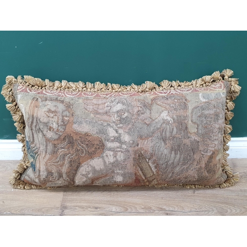 537 - An antique Tapestry Panel made into a cushion, decorated with cherub flanked by lion and griffin, an... 