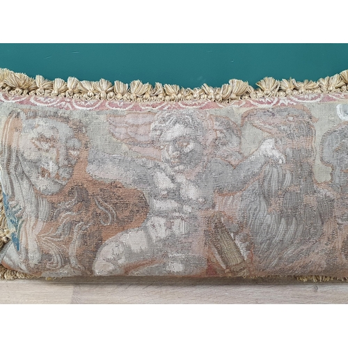 537 - An antique Tapestry Panel made into a cushion, decorated with cherub flanked by lion and griffin, an... 