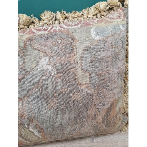 537 - An antique Tapestry Panel made into a cushion, decorated with cherub flanked by lion and griffin, an... 