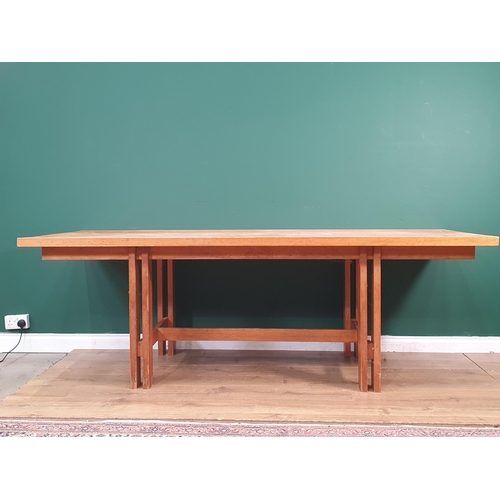 540 - A large modern pine Kitchen Table, on pierced square supports united by central stretcher made by Ge... 