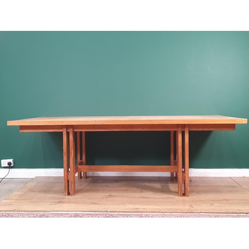 540 - A large modern pine Kitchen Table, on pierced square supports united by central stretcher made by Ge... 