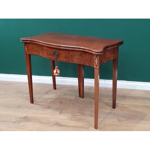 544 - An early 19th Century mahogany serpentine fronted Tea Table, the foldover top above single fitted dr... 