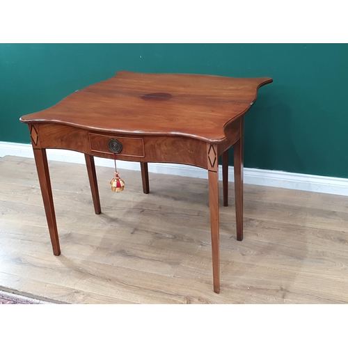 544 - An early 19th Century mahogany serpentine fronted Tea Table, the foldover top above single fitted dr... 