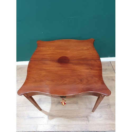 544 - An early 19th Century mahogany serpentine fronted Tea Table, the foldover top above single fitted dr... 